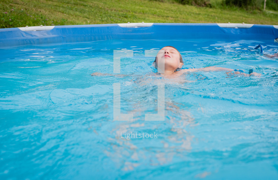 a boy in a pool 