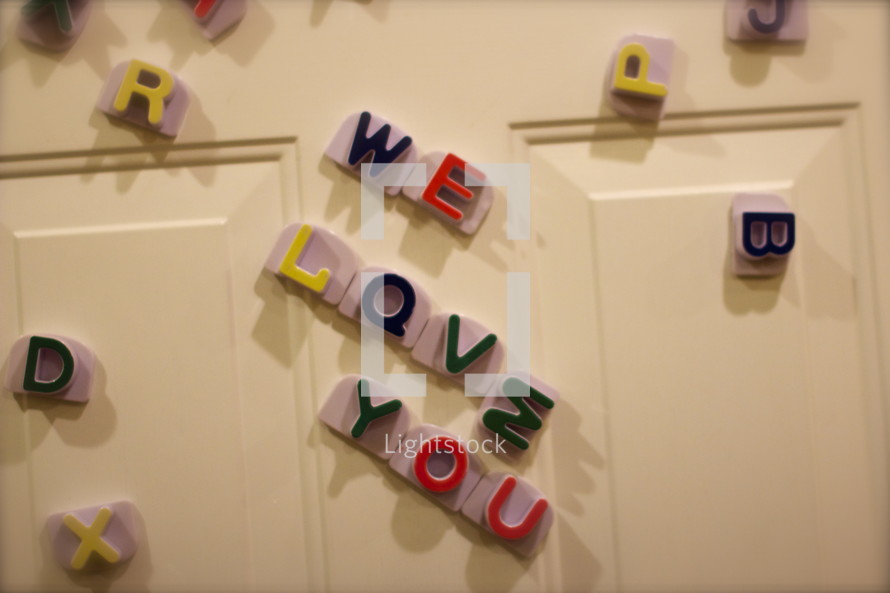 We Love You written in magnets on a refrigerator 