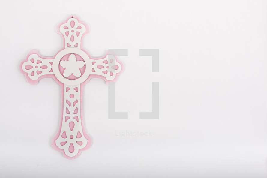 pink and white ornate cross