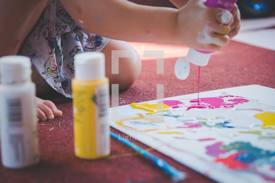 a toddler painting 