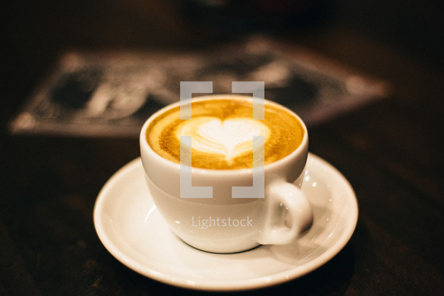 heart shape in a mug of cappuccino 