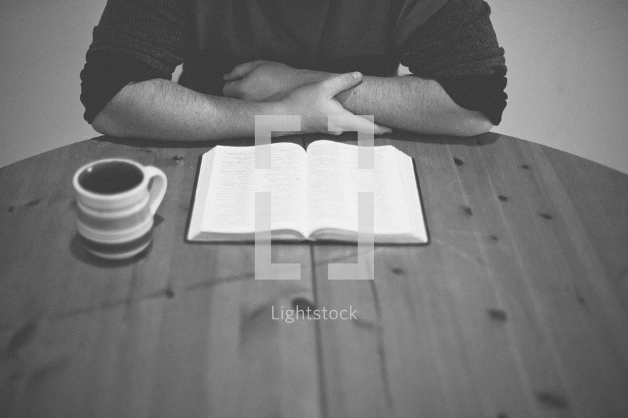 A man reading a Bible. 