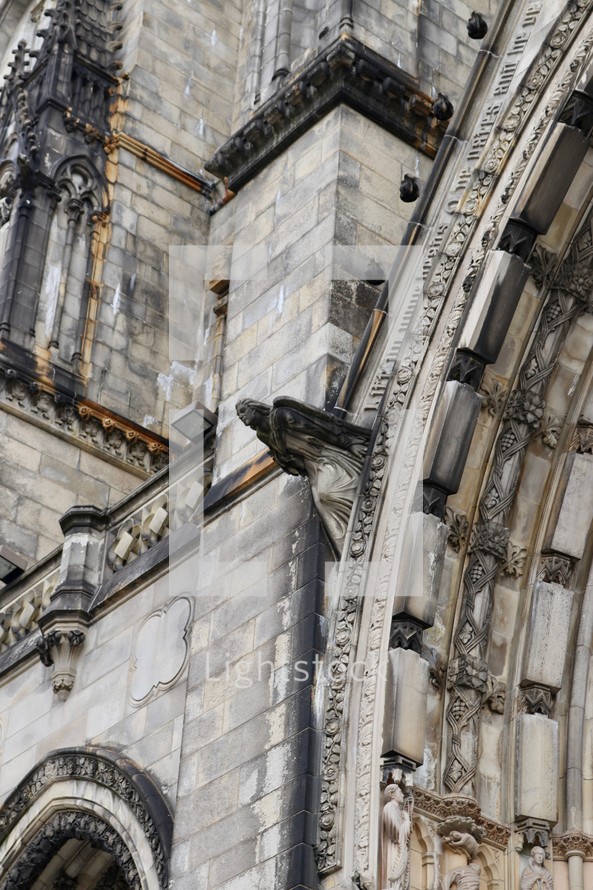 stone angel on a cathedral exterior 