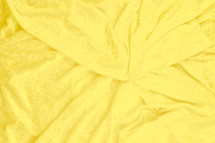 neutral soft yellow velvet fabric background 