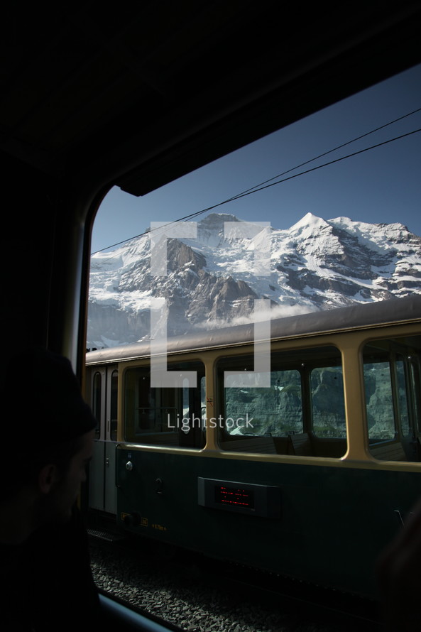 cable car and snowy mountain peaks 