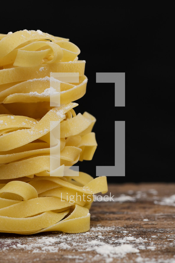 Closeup Tagliatelle Pasta on Black Background