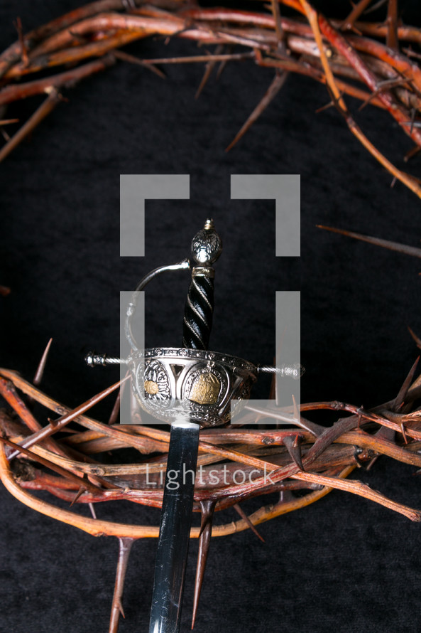 sword and crown of thorns on a black background 