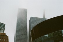 fog over city skyscrapers 