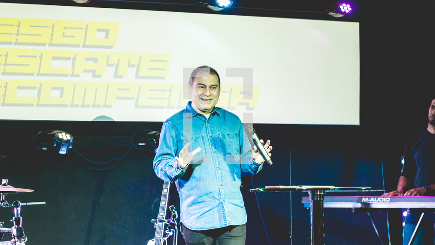 pastor holding a microphone 