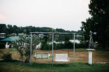 swings outdoors by a lake 