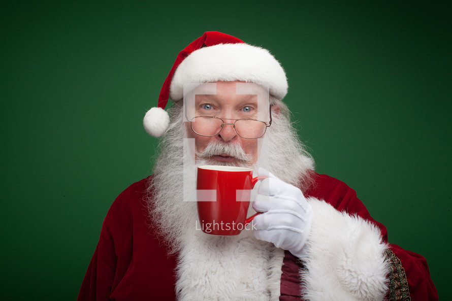 Santa holding a mug