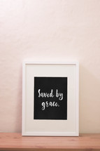 word saved by his grace in a frame