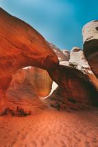 red rock arch and sand 