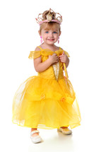 A little girl dressed as a princess.