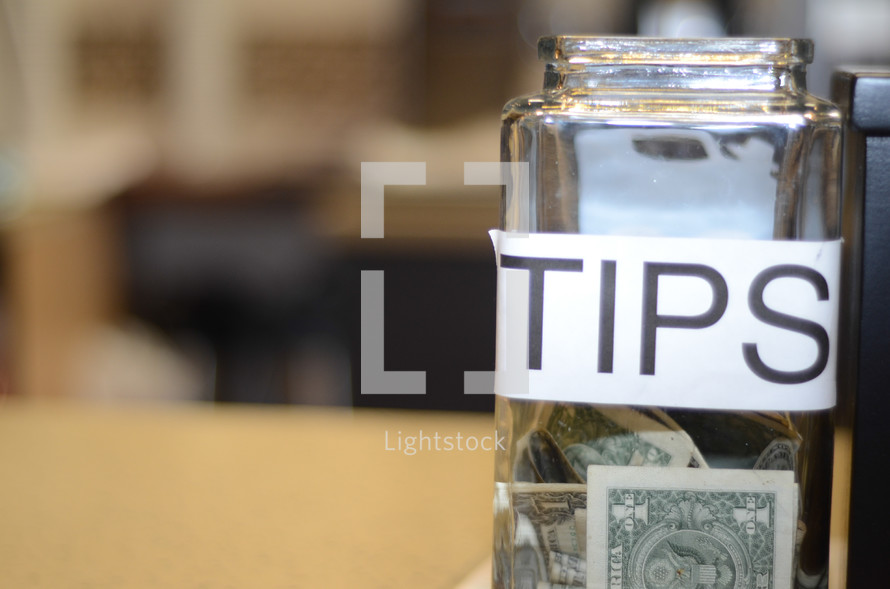 a tip jar on a counter 