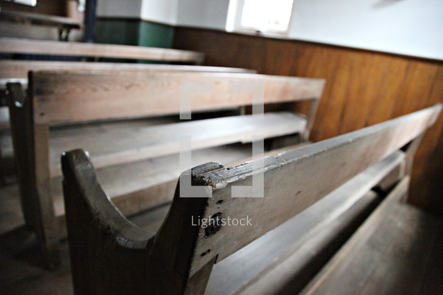 vintage pews in an empty church 
