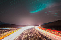 Streaks of light racing on a road