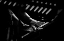 fingers playing on a keyboard 