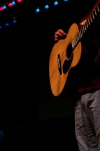 Man playing guitar on stage