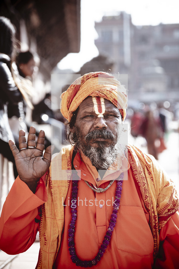 man in orange in Tibet 