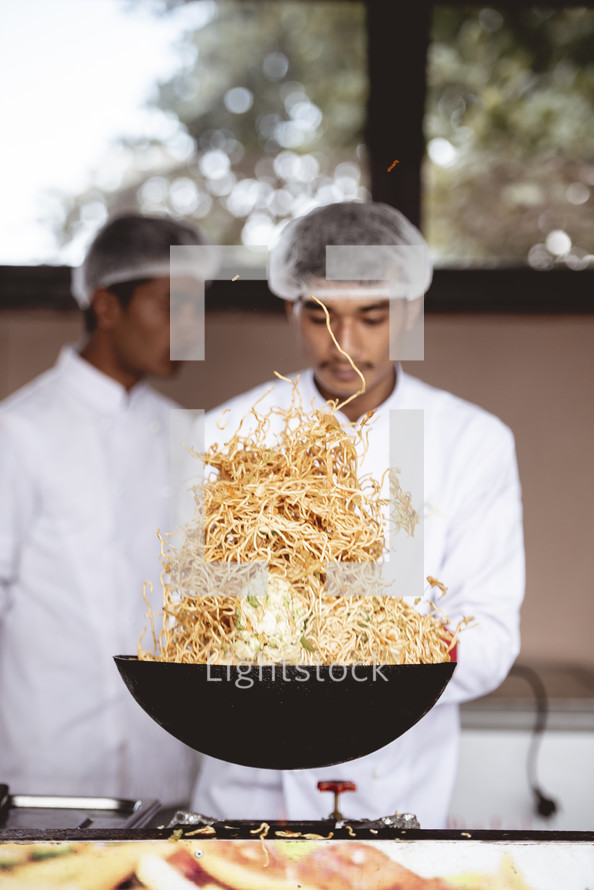 cooking noodles in a kitchen 