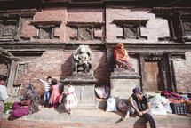 families on a sidewalk in Tibet 