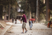 children playing on a gravel road 