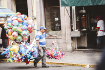 street vendor selling, balloons, and inflatables 