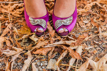 toes peeking through pink dress shoes fall leaves