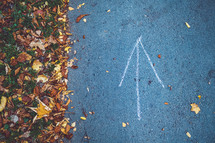 arrow on a paved path 