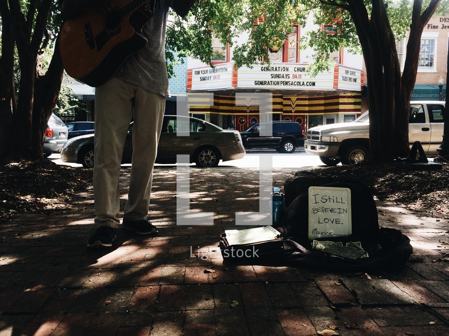 street musician begging for money 