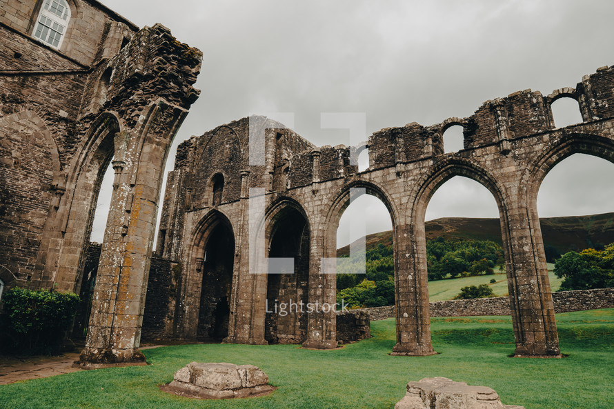 Landmarks of Wales travel concept. View of ancient ruins of the castle/church in Brecon Beacons National Park, United Kingdom. Llanthony Priory Abbey in the Vale of Ewyas. Llanthony priory ruins.