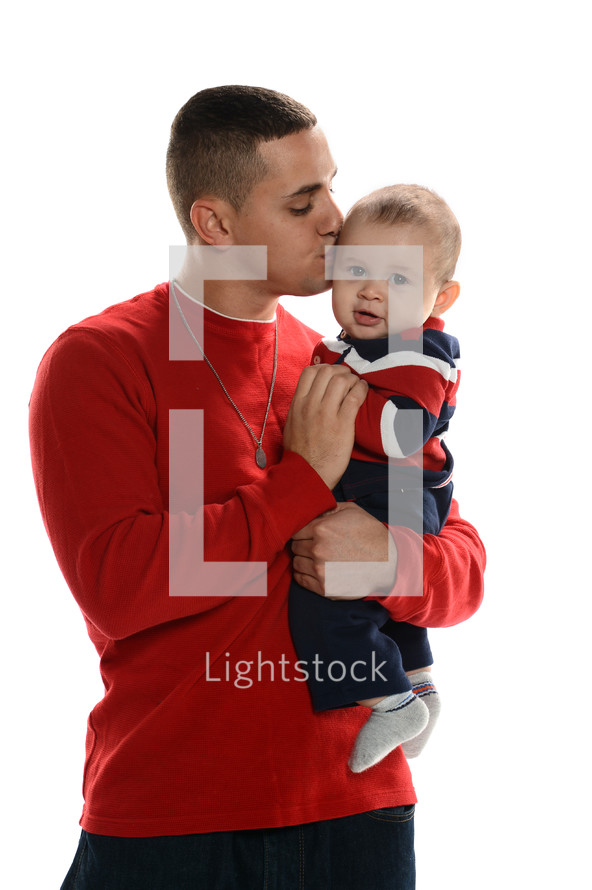 father kissing his infant son 