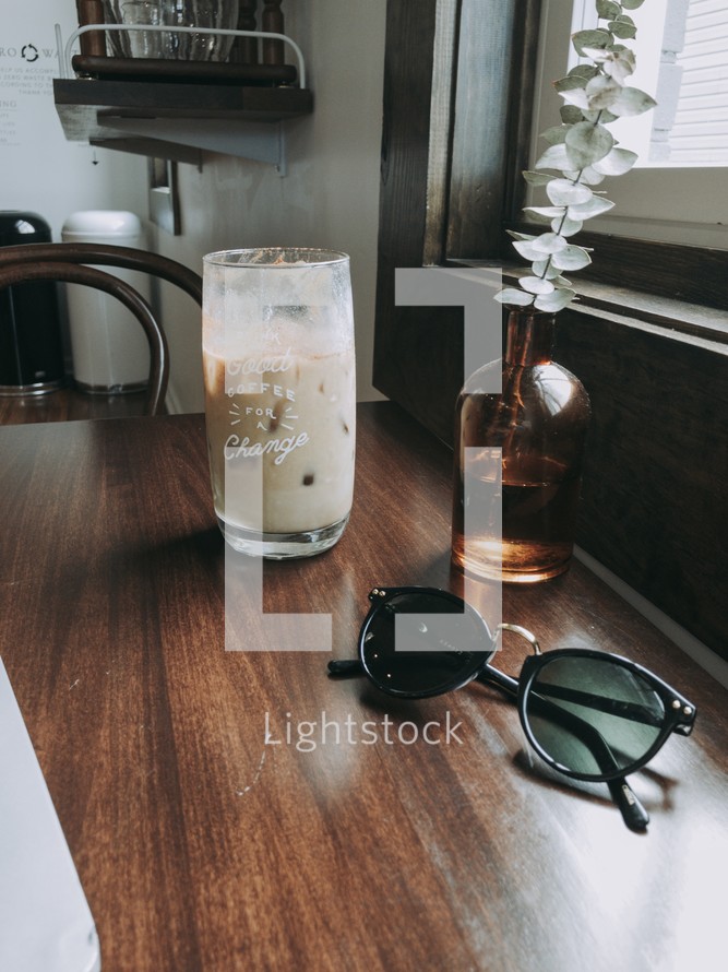 sunglasses on a wooden table 