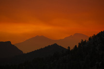 orange sky at sunset over mountains 