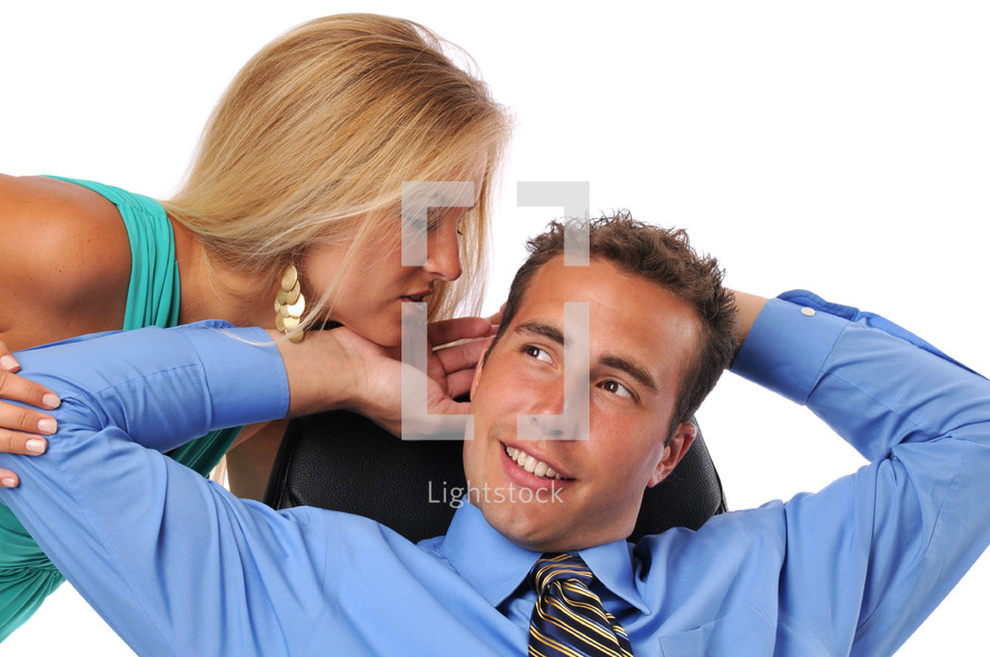 woman kissing a businessman 