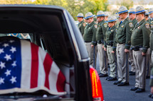 Highway patrol officers honoring fallen officer, casket, Hurst, American flag, honor, respect, risk, gratitude price for freedom