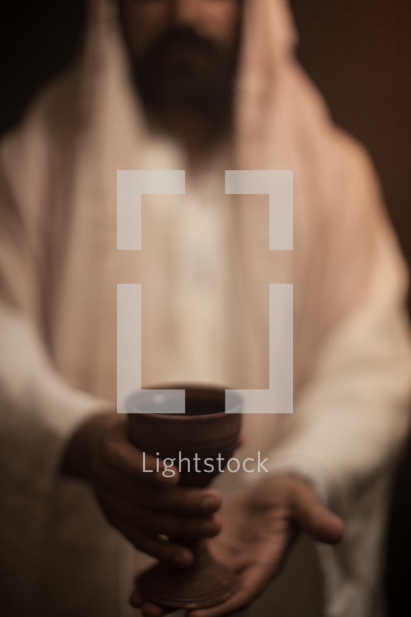 Jesus holding a communion chalice 
