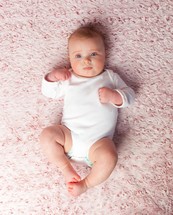 infant rug on a pink rug 