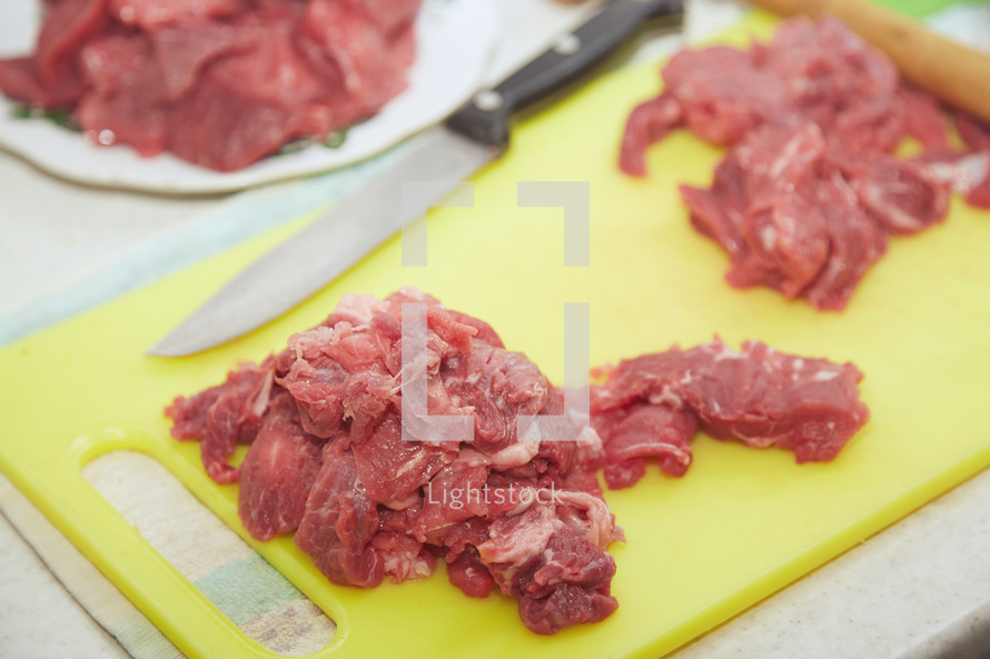 raw meat on a cutting board 