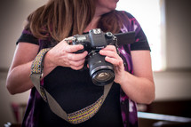 a photographer holding a camera 