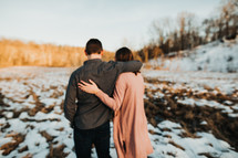 a couple walking outdoors in winter 
