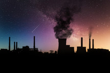 Dark harmful smoke from chimneys of power plant silhouette on night sky with milky way.