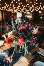 flower arrangement on a table at a wedding 