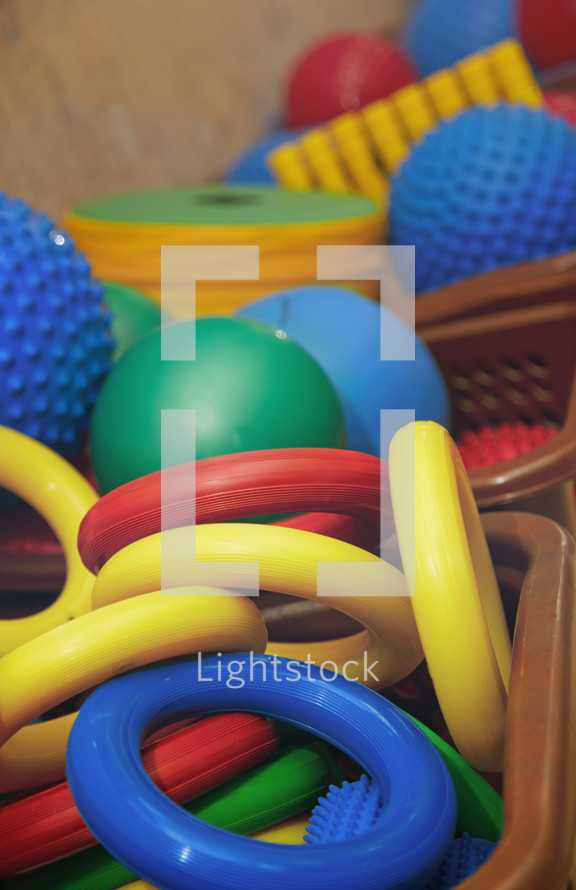 Rubber rings and balls at playground. Close-up photo