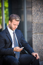 businessman checking his cellphone 
