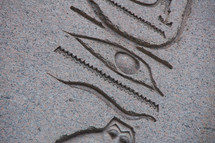 Egyptian hieroglyphics carved into stone