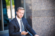 portrait of a businessman holding a cellphone 
