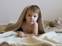 Cute baby under blanket