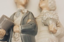 closeup of a bride and groom cake topper